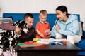 happy family with their son and dog Dalmatian sit at the table at home Royalty Free Stock Photo