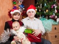 Happy family of three celebrating Christmas Royalty Free Stock Photo