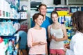 Happy family of three consulting druggist Royalty Free Stock Photo