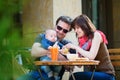 Happy family of three having breakfast Royalty Free Stock Photo