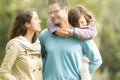 Happy family of three having fun outdoor. Royalty Free Stock Photo