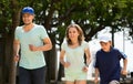 Happy family of three jogging Royalty Free Stock Photo