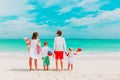 Happy family with three kids walk on beach Royalty Free Stock Photo