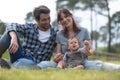 happy family three lying in grass in autumn Royalty Free Stock Photo