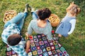 Happy family of three lying in the grass in autumn Royalty Free Stock Photo