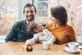 Happy family of three mother, father and son, sitting in restaurant Royalty Free Stock Photo