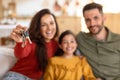 Family showing new house keys, selective focus Royalty Free Stock Photo