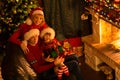 Happy family of three persons in red hats with Royalty Free Stock Photo