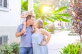 Happy family of three - pregnant mother, father and daughter hugging, laughing, having fun in the sunset park. Family recreation, Royalty Free Stock Photo