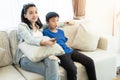 Happy family time. Mother and son relaxing in living room Royalty Free Stock Photo