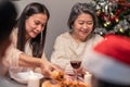Happy family time and relationship, Asian big family having small party eating food at home. Grandparent is happy to see his child