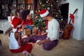 Family together exchanging gifts at Christmas morning Royalty Free Stock Photo