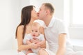 Happy family together home, mother and father with baby in white room Royalty Free Stock Photo