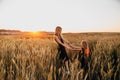 Happy family together on sunset in summer golden wheat field. Summertime Royalty Free Stock Photo
