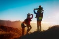 Happy family travel in mountains at sunset Royalty Free Stock Photo
