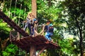 Happy family travel tourist enjoy an exciting journey on one of the most popular tourist attraction, Flight of the Gibbon