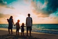 Happy family with tree kids walk at sunset beach Royalty Free Stock Photo