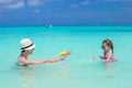 Happy family at tropical beach having fun