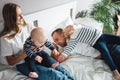 Happy family with two child have fun at home