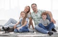 Happy family with two children and a dog Royalty Free Stock Photo