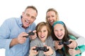 Happy family with two children playing video games Royalty Free Stock Photo