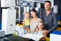 Happy family with two children shopping