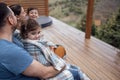 Happy family with two children is sitting on the terrace at home Royalty Free Stock Photo