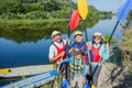 Happy family with two kids enjoying kayak ride on beautiful river. Little boy and teenager girl kayaking on hot summer Royalty Free Stock Photo