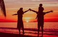 Happy family with two kids having fun on sunset beach Royalty Free Stock Photo