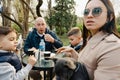 Happy family with two kids having a sancak at outdoor cafe on autumn day Royalty Free Stock Photo