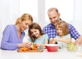 Happy family with two kids making dinner at home Royalty Free Stock Photo