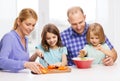 Happy family with two kids making dinner at home Royalty Free Stock Photo