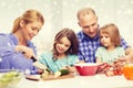 Happy family with two kids making dinner at home Royalty Free Stock Photo