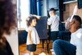 Happy family with two kids playing at home while sitting at floor parquet Royalty Free Stock Photo