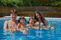 Happy family with two kids in swimming pool Royalty Free Stock Photo