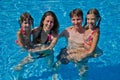 Happy family with two kids in swimming pool Royalty Free Stock Photo