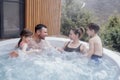 Happy family with two small children have fun in the jacuzzi Royalty Free Stock Photo