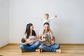 happy family with two sons and grey british shorthair cat