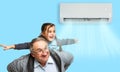 Happy Family Under Air Conditioning Royalty Free Stock Photo