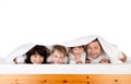 Happy family under blanket Royalty Free Stock Photo
