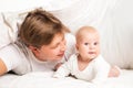 Happy family under blanket on the bed at home Royalty Free Stock Photo