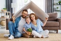 Happy family under fake roof in living room