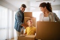 Happy family unpacking boxes in new home on moving day Royalty Free Stock Photo