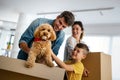 Happy family unpacking boxes in new home on moving day Royalty Free Stock Photo