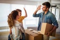 Happy family unpacking boxes in new home on moving day Royalty Free Stock Photo