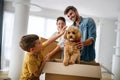 Happy family unpacking boxes in new home on moving day Royalty Free Stock Photo