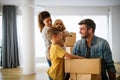 Happy family unpacking boxes in new home on moving day Royalty Free Stock Photo