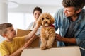 Happy family unpacking boxes in new home on moving day Royalty Free Stock Photo