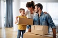 Happy family unpacking boxes in new home on moving day Royalty Free Stock Photo