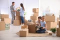 Happy family unpacking moving boxes at their home Royalty Free Stock Photo